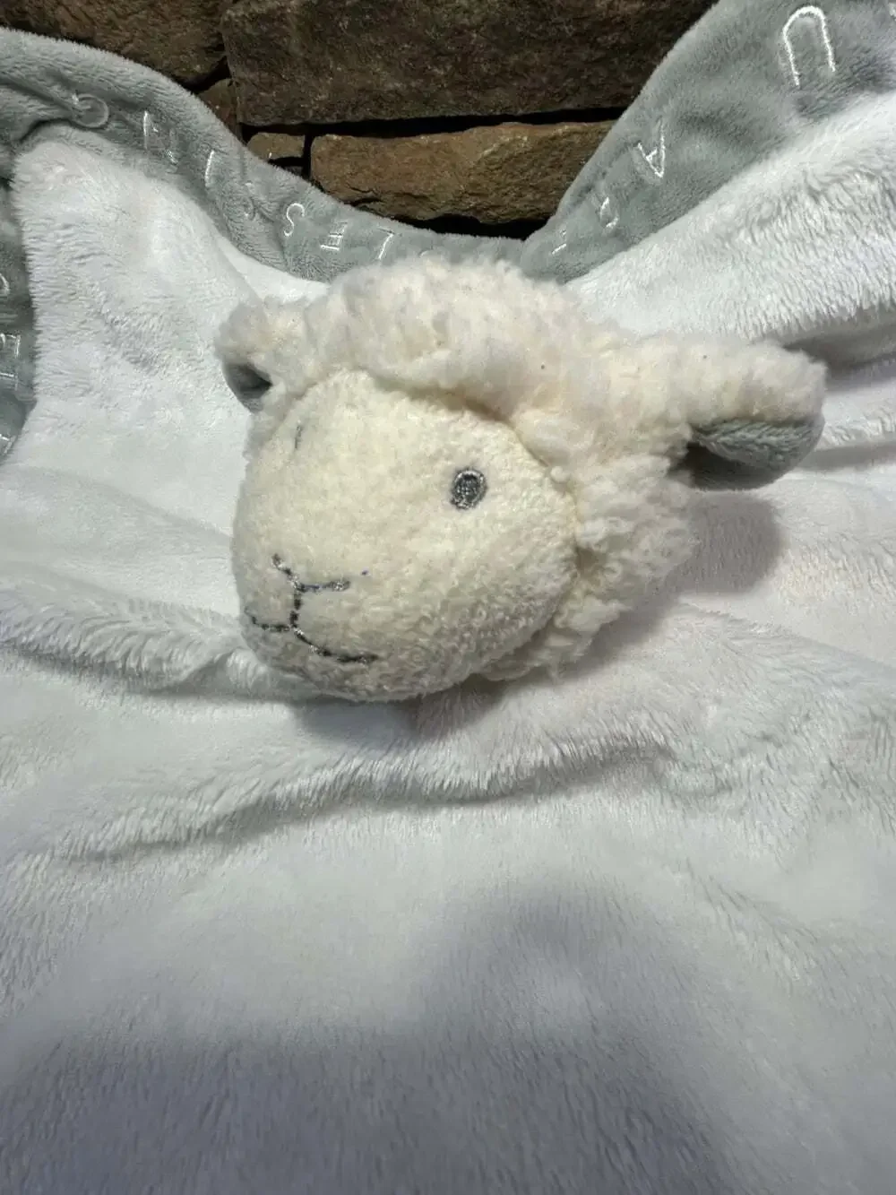 Grasslands Road white lamb sheep lovey with writing on edges